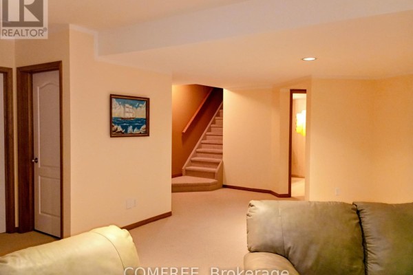 Basement living area with stairs and sofa - 35 Tanya Drive Southwest Middlesex