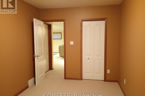 Hallway with tan walls and beige carpet - 35 Tanya Drive Southwest Middlesex