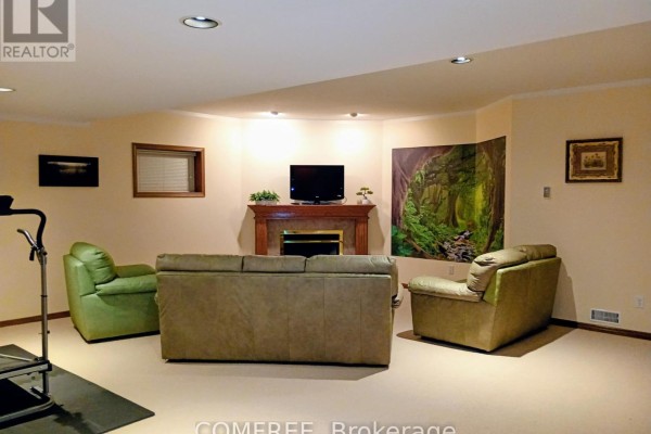 Living room with fireplace, TV, and seating - 35 Tanya Drive Southwest Middlesex