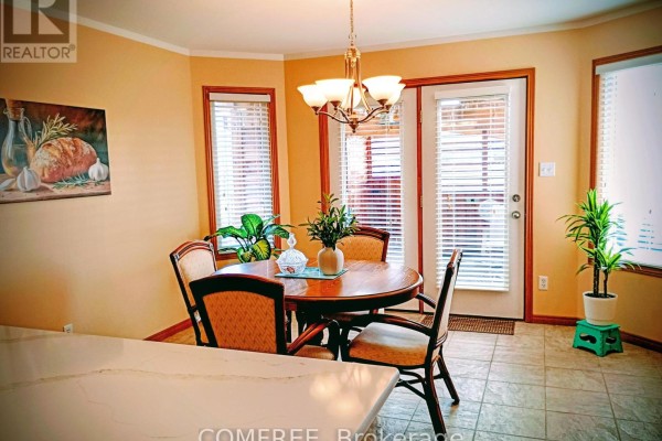 Round dining table and chairs near glass door - 35 Tanya Drive Southwest Middlesex