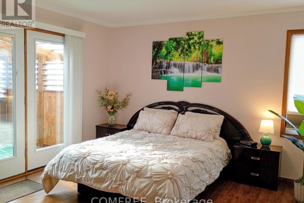 Bedroom with waterfall artwork and double doors - 35 Tanya Drive Southwest Middlesex