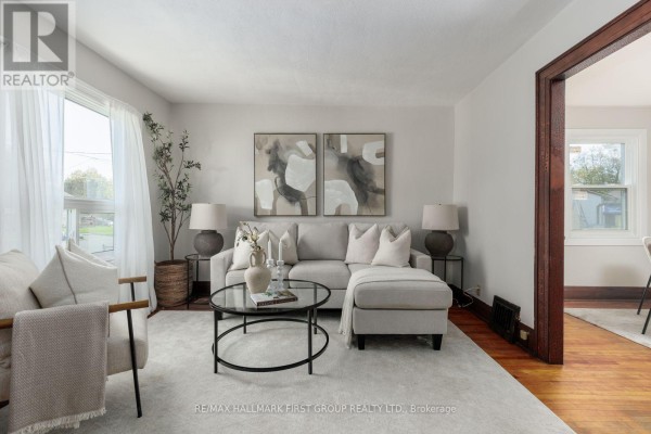 Basement with wood paneling, concrete floor, water heater, furnace, and shop vacuum. - 350 Oshawa Boulevard S, Oshawa