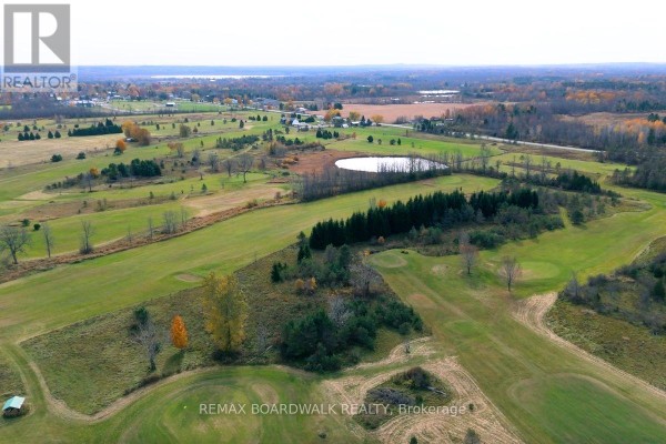 Aerial view of rolling green hills and scattered trees, suggesting a golf course. - 353 County Rd 5 Road, Athens
