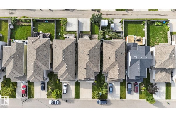 Overhead view of townhouses with attached garages and backyards. - 3536 Claxton Cr Sw Sw, Edmonton