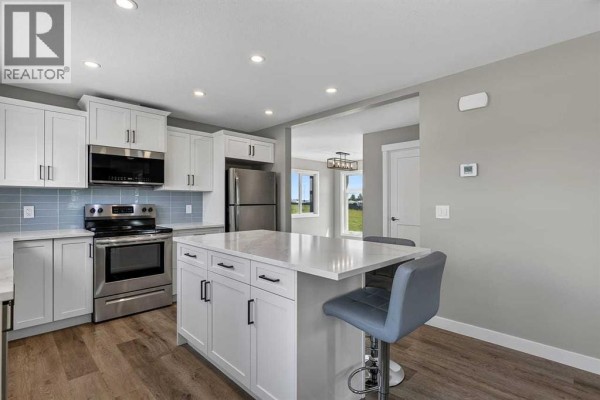 Living room - 354096 48 Street E, Okotoks, AB T1S1A7 Photo 5