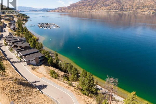 Expansive view of the lake, marina, and hillside homes from a property on Arrowroot Drive. - 3548 Arrowroot Drive, Kelowna