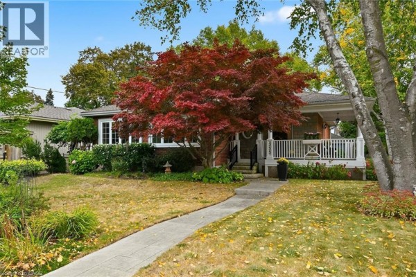 Exterior front view of the house with a pathway and porch. - 355 Newbold Drive, Burlington