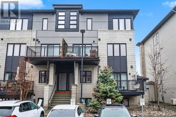 Front entrance of a townhouse complex with stairs and balconies. - 36 - 454 Via Verona Street, Ottawa