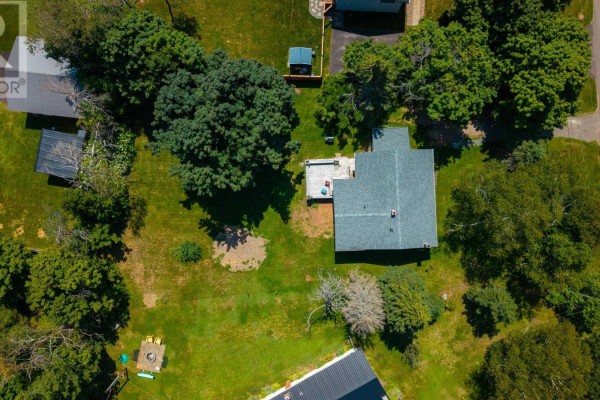 Top-down aerial view of the property at 36 Bonavista Drive, showing the house, yard, and surrounding trees. - 36 Bonavista Drive, Cornwall
