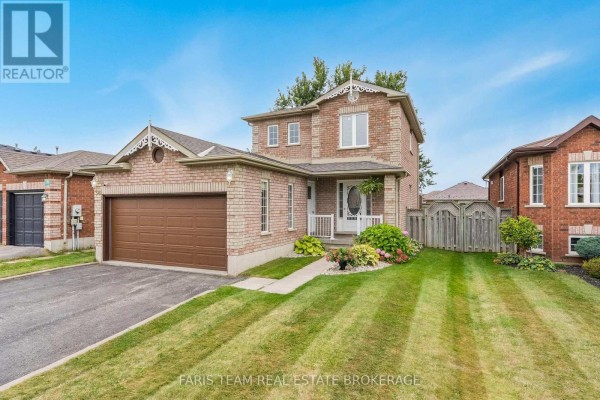 Front exterior view of a two-story brick house with a covered porch and landscaped garden. - 36 Red Oak Drive, Barrie