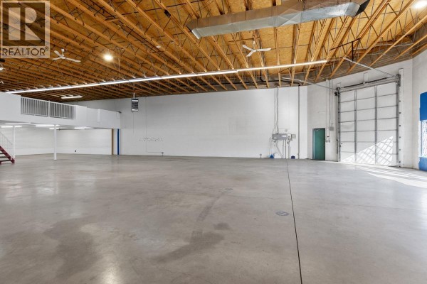 Spacious interior with polished concrete floor and high wooden ceiling. - 360 Spedding Court Unit# 4, Kelowna