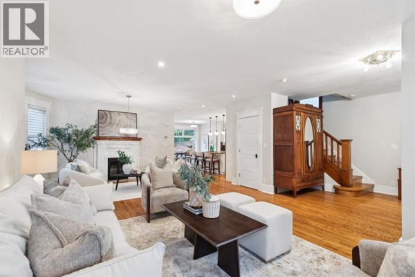 Interior entryway with a wooden staircase, bench, radiator, and wood floor. - 3607 7 Street Sw, Calgary
