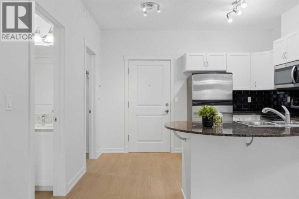 Living room - 3610, 11811 Lake Fraser Drive Se, Calgary, AB T2J7J1 Photo 3