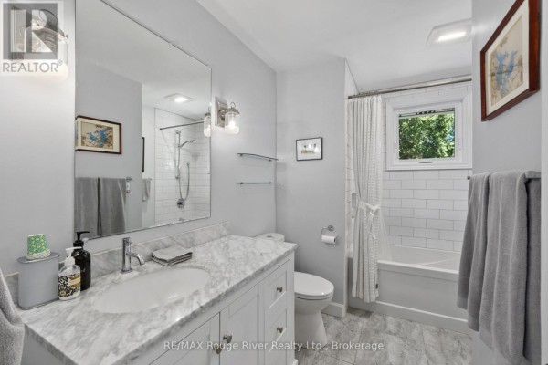 Bathroom with marble vanity and subway tile shower - 3625 Alnwick Hill Road Hamilton Township