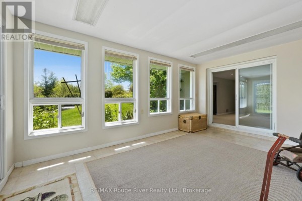 Sunroom with large windows and sliding glass door - 3625 Alnwick Hill Road Hamilton Township