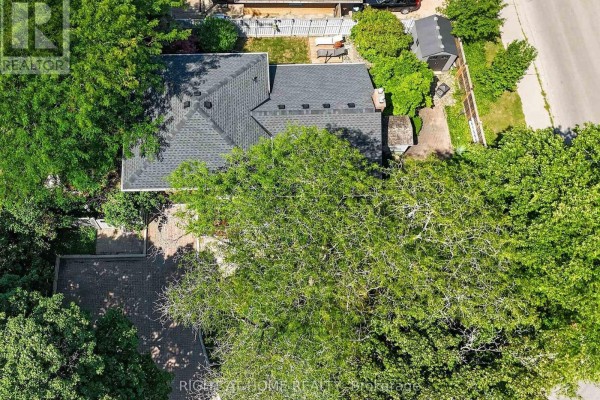 Aerial view of house with pitched roof and dormer windows, shed, and paved driveway - 366 Burlington Crescent London South