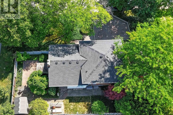 House with mature trees, paved driveway, deck, and shed - 366 Burlington Crescent London South