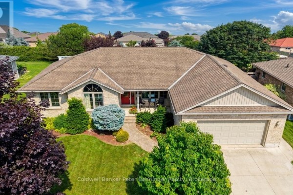 Aerial view of a brick bungalow with a double garage and red front door. - 366 Westwood Drive, Brockton