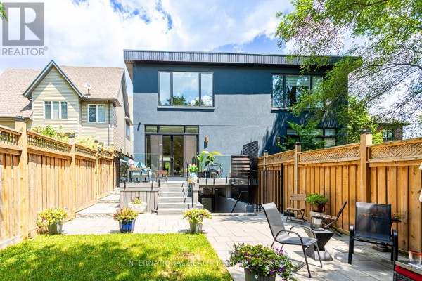 Modern backyard with deck, patio, and outdoor seating - 36b Pine Avenue Mississauga