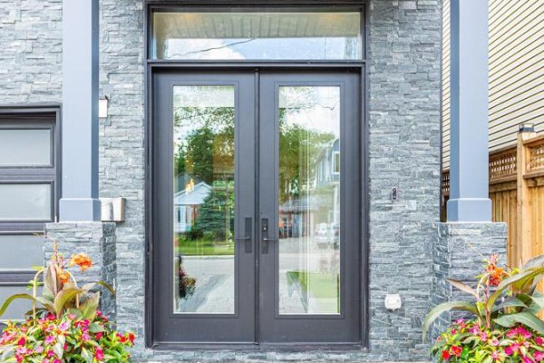Modern double glass doors with stone facade and planter pots - 36b Pine Avenue Mississauga