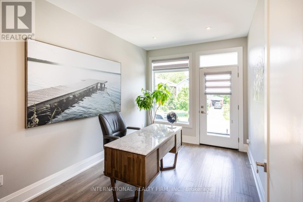Office with dock artwork, marble desk, globe, and leather chair - 36b Pine Avenue Mississauga