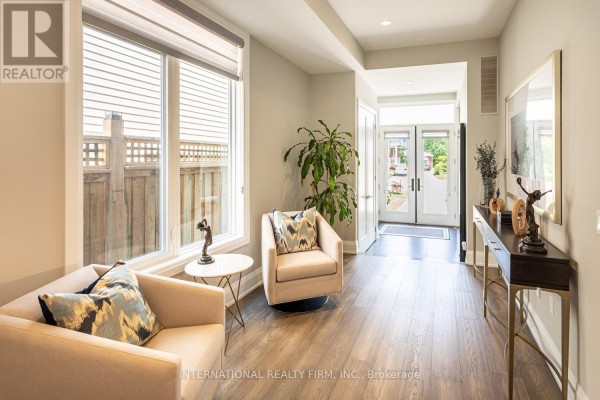 Living room with seating, console table, and double doors - 36b Pine Avenue Mississauga