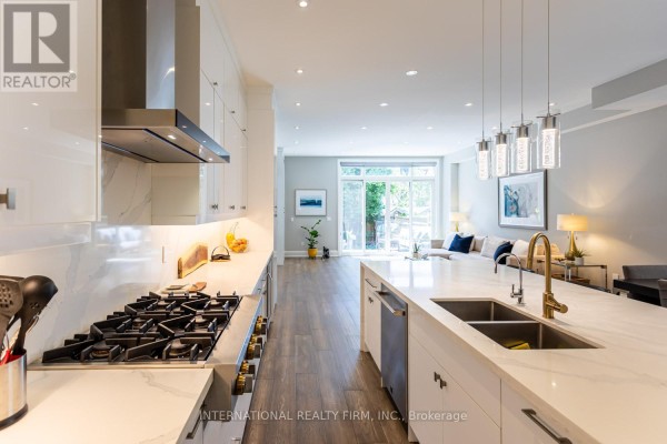 Modern kitchen with marble island and gas range - 36b Pine Avenue Mississauga