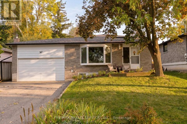 Front exterior of a brick bungalow with a white garage door and a sloped front lawn. - 37 Maple Avenue W, New Tecumseth