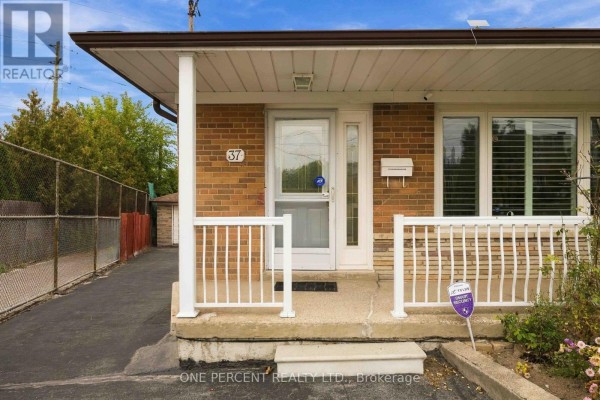 Close-up of the front entrance with a white door and porch railings. - 37 Wilmont Drive, Toronto