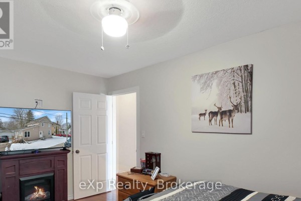 Bedroom with electric fireplace, TV, deer art, dresser - 370 6th Avenue Hanover