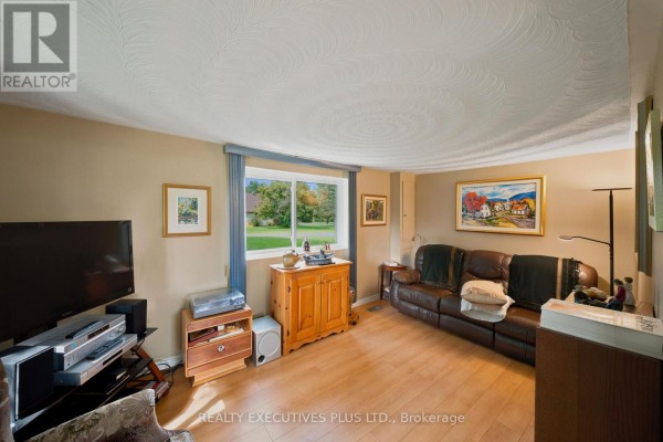 Leather sofa, TV, and stereo system in living room - 3705 Champlain Street E Clarence Rockland
