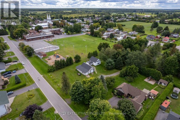 Aerial view of Clarence-Rockland neighborhood with school, church, and recreational field.