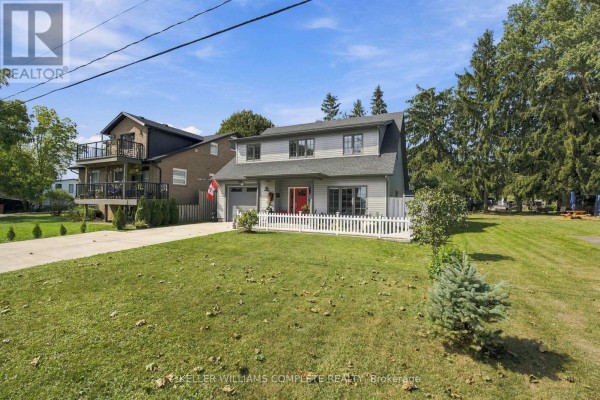 View of the home from across the street, with neighbors visible. - 3710 Crystal Beach Drive N, Fort Erie