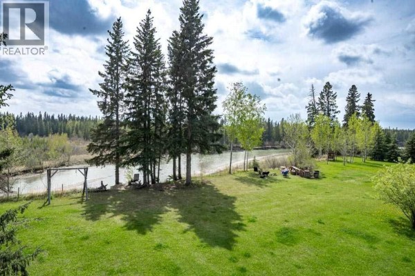Basement area with water filtration system, insulation, and a window for natural light. - 374074 Range Road 6-2, Rural Clearwater County