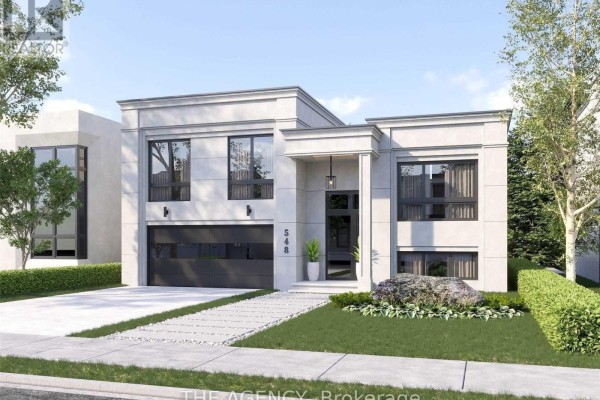 Contemporary house exterior with a white stone facade, black trim, and a minimalist landscape design. - 3745 Sunbank Crescent, Severn