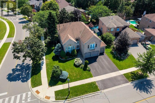 Aerial view of a suburban house with a large lawn, driveway, and neighboring properties. - 376 Keith Avenue, Newmarket