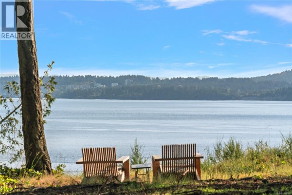 Overhead view of a calm body of water with forested islands and distant mountains. - 377 Evergreen Lane, Sidney Island
