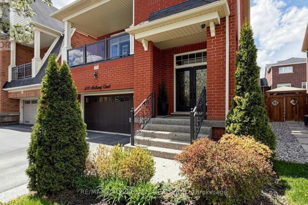 Front view of red brick house with large tree in yard. - 378 Malboeuf Court, Milton