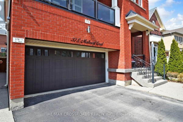 Street view of attached houses, including one with an attached garage. - 378 Malboeuf Court, Milton