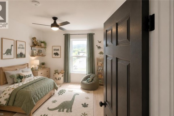 Kid's bedroom with dinosaur theme, twin bed, dresser, bean bag chair, and window. - 379 Main Street Unit# 3, Woodstock