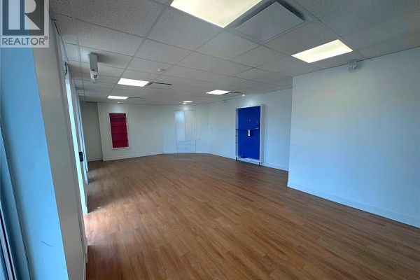 Another view of the empty commercial space, highlighting interior doors and walls. - 379 Parkview Road, Yorkton