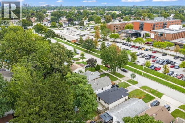 Aerial view of the subject property surrounded by trees and houses. - 3796 Glenfield Street, Windsor