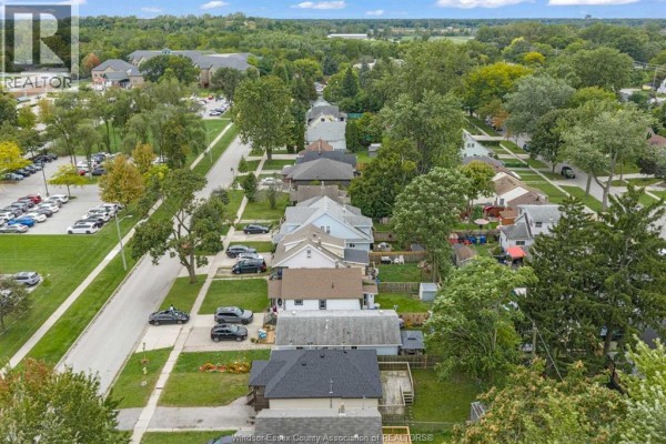 Aerial view down a residential street with trees and homes on both sides. - 3796 Glenfield Street, Windsor