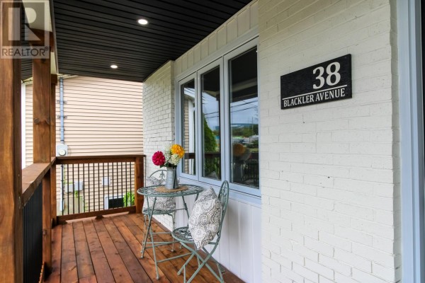 Bathroom with a granite countertop, toilet, and shower curtain - 38 Blackler Avenue, St  John S