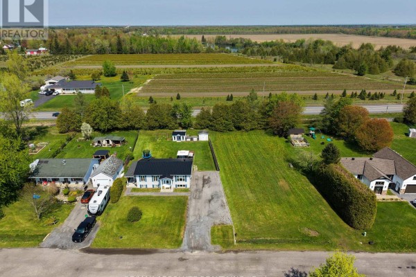 Aerial view of the property showing the house, yard, and surrounding rural landscape. - 38 Duchesse Crescent, Russell