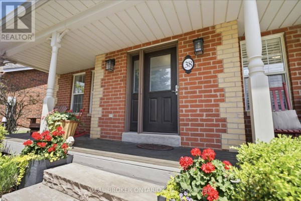 Close-up of the front entrance with a dark brown door, number 38, and brick detailing. - 38 Galloway Crescent, Uxbridge