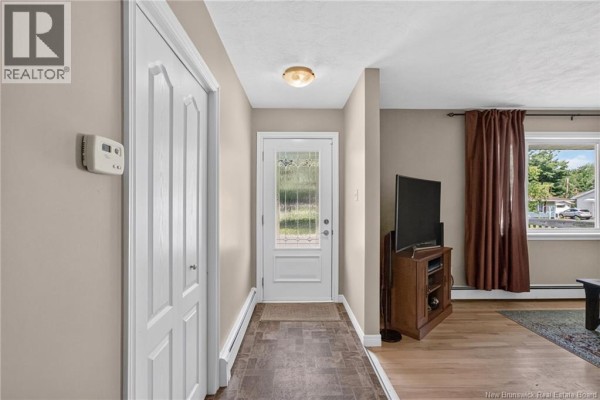 Interior entryway with a closed closet, door to the exterior, and access to the living area. - 38 Lindsay Street, Riverview