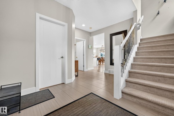 Top-down aerial view of a house lot with a driveway, backyard, and surrounding properties. - 3803 48 Av, Beaumont