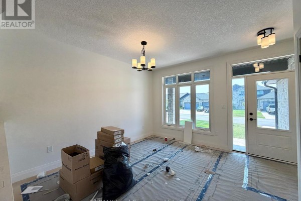 Empty room with tiled floor and plumbing hookups for a laundry area. - 383 Rosner Drive, Saugeen Shores