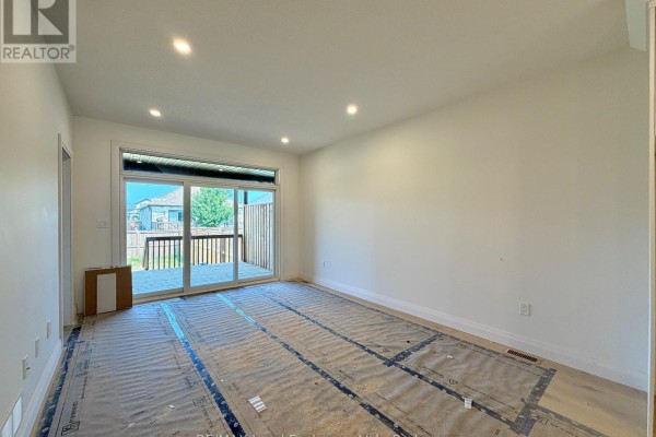 Room with bare walls, unfinished windows, and plumbing in the corner. - 383 Rosner Drive, Saugeen Shores